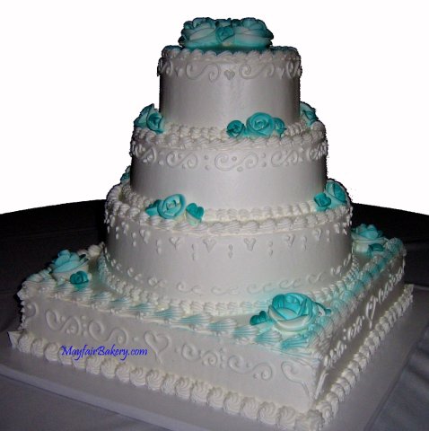 4 tier15-3 - 4 tiers round and square. Teal airbrushed buttercream roses.7&quot;, 10&quot;, 13&quot;, 16&quot; tiers. 35 pounds. Serves 175 to 200.